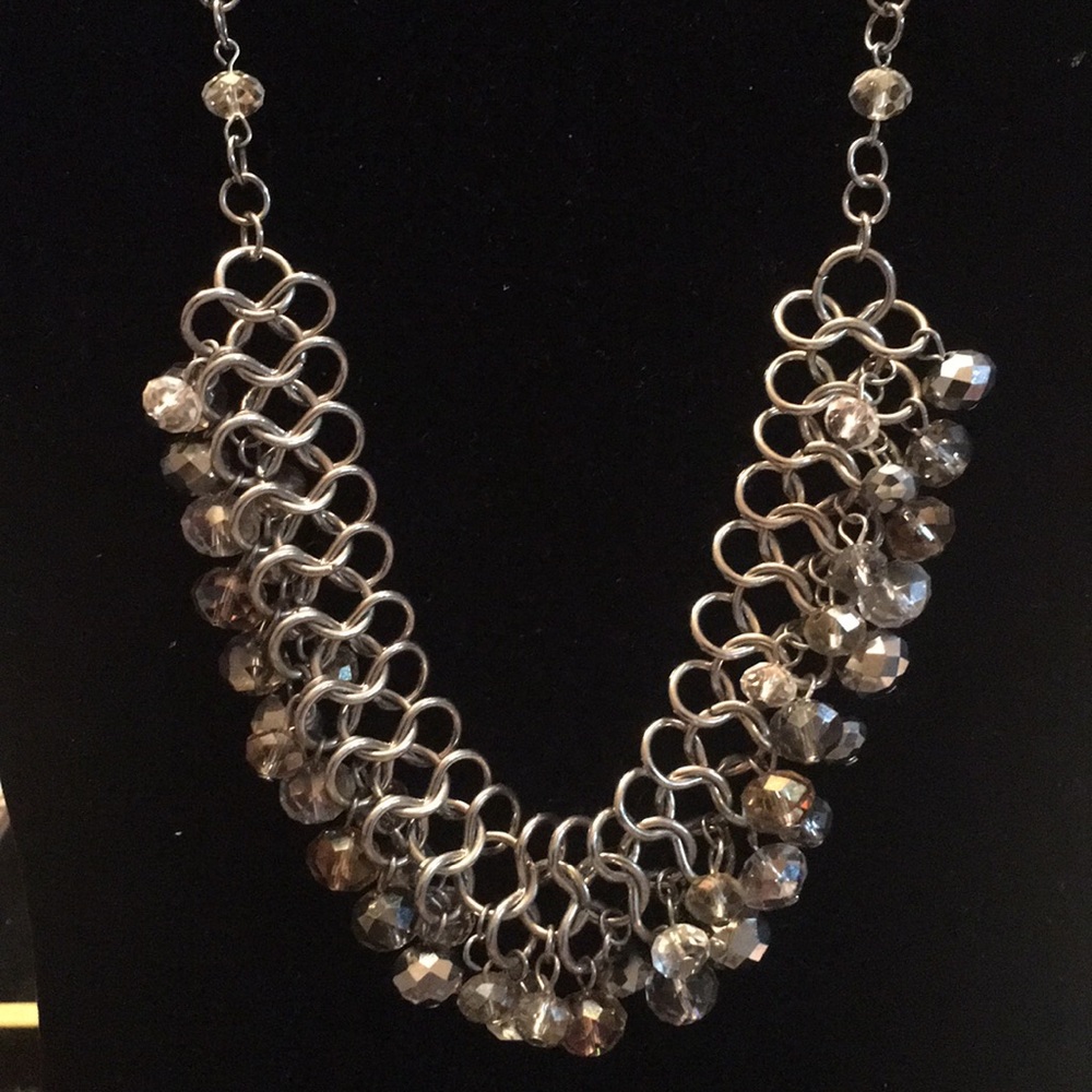 Silver necklace light topaz color stone and clear.